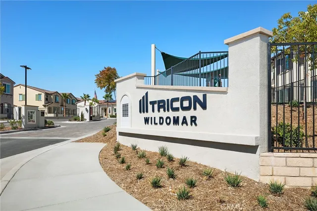 a view of a patio with couches table and chairs and potted plants