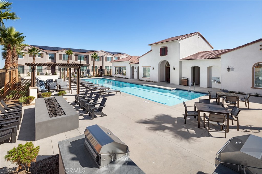 24967 Padre Court Wildomar, CA 92595 - Photo 27 of 30 a view of a patio with couches table and chairs and potted plants