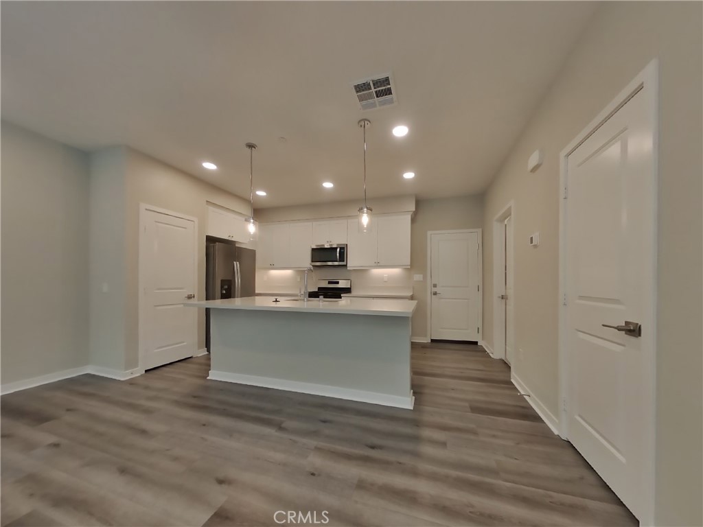 24967 Padre Court Wildomar, CA 92595 - Photo 3 of 30 a view of kitchen with sink microwave and refrigerator
