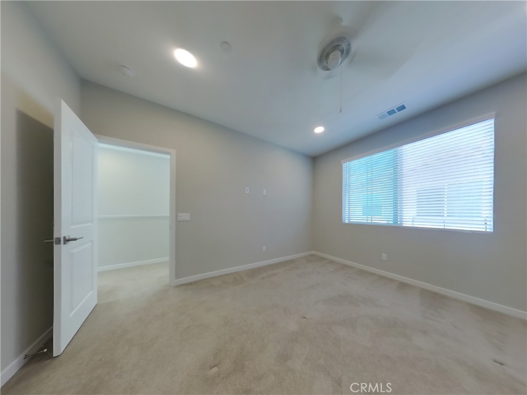 24967 Padre Court Wildomar, CA 92595 - Photo 7 of 30 an empty room with windows