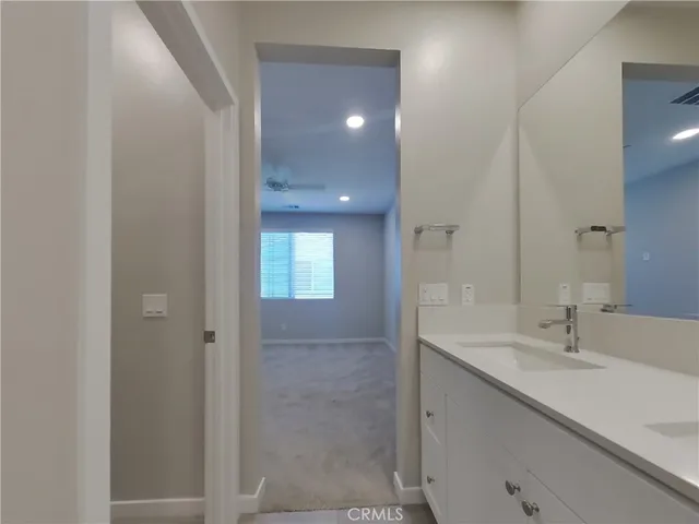 a bathroom with a shower and a sink