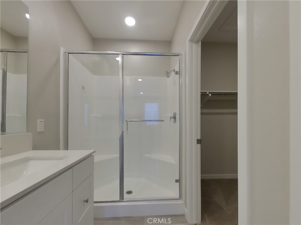 24967 Padre Court Wildomar, CA 92595 - Photo 9 of 30 a bathroom with a shower and a sink