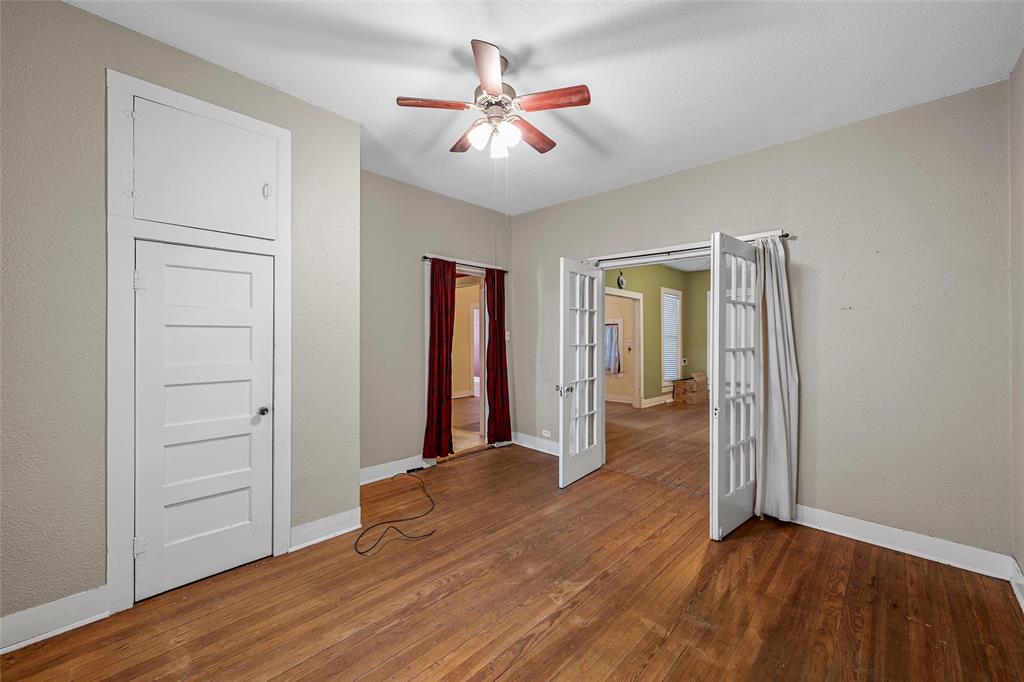 2623 North 15th A Street Waco, TX 76708 - Photo 12 of 23 wooden floor in an empty room with a window