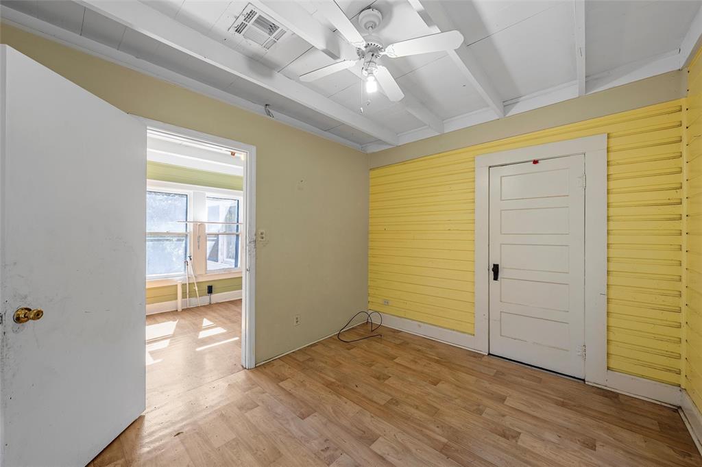 2623 North 15th A Street Waco, TX 76708 - Photo 18 of 23 wooden floor in an empty room with a window