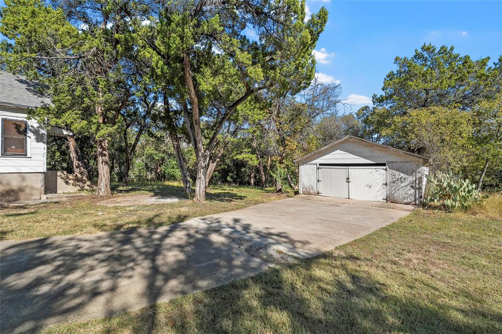 2623 North 15th A Street Waco, TX 76708 - Photo 20 of 23 a dirt road with a building in the background