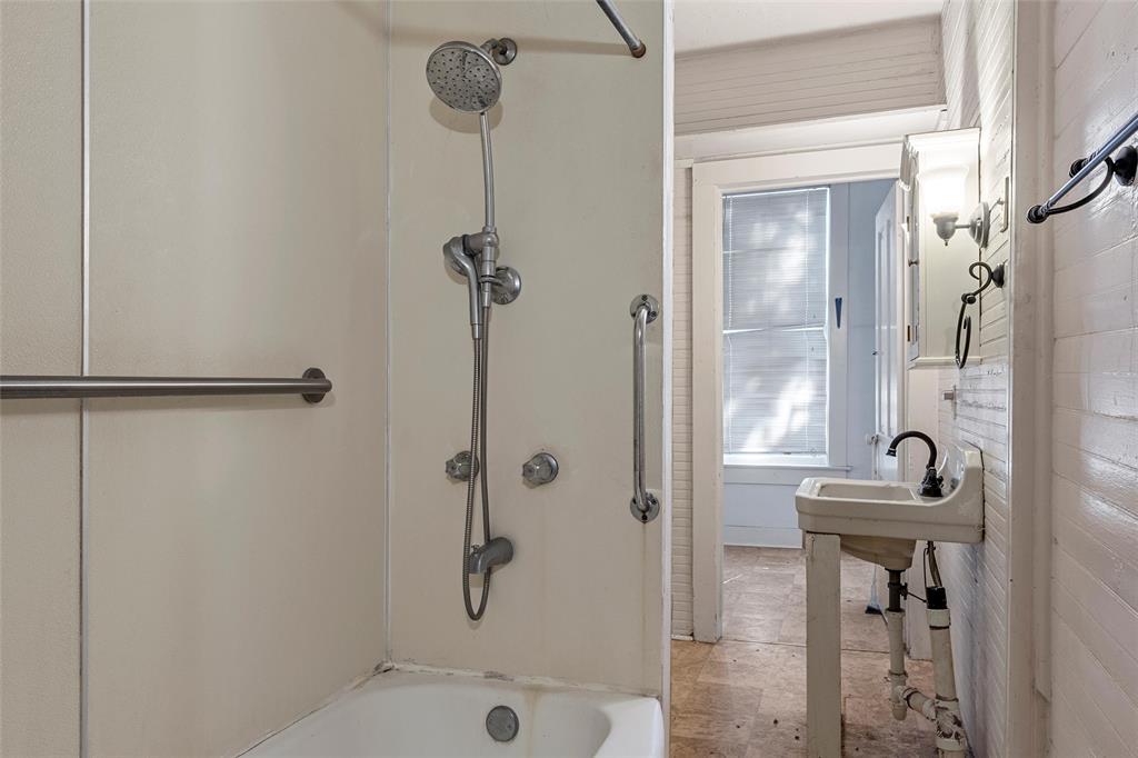 2623 North 15th A Street Waco, TX 76708 - Photo 8 of 23 a bathroom with a sink a toilet and shower