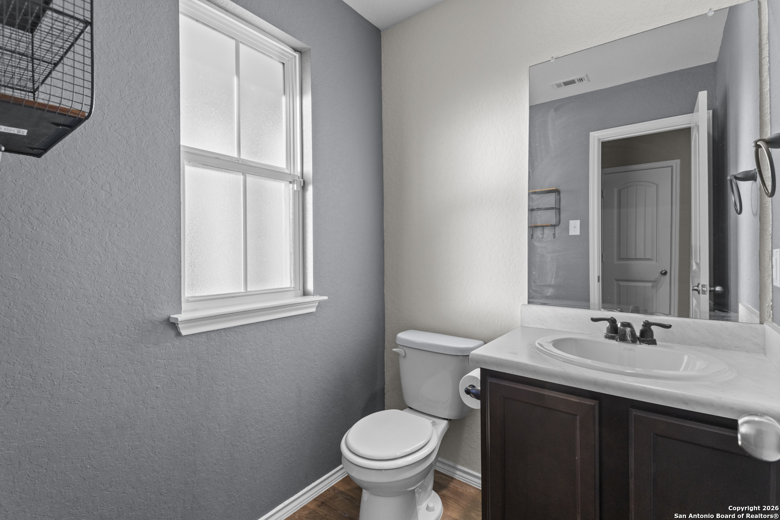 4106 Winterfell Pass Converse, TX 78109 - Photo 27 of 31 a bathroom with a sink a toilet and mirror