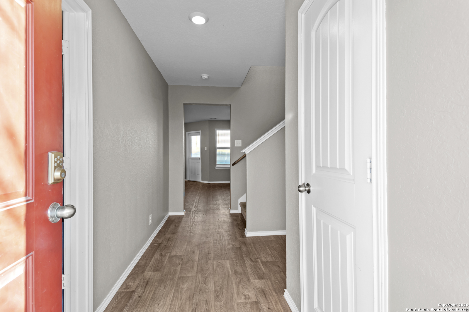 4106 Winterfell Pass Converse, TX 78109 - Photo 5 of 31 a view of a hallway with wooden floor and staircase