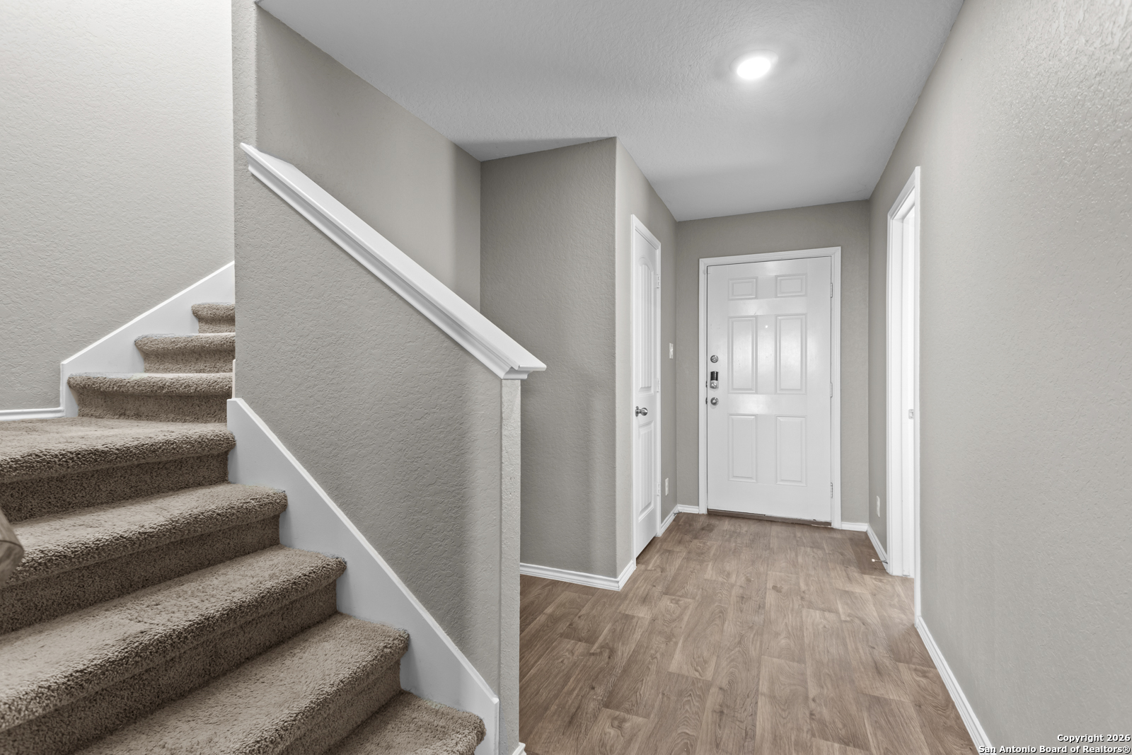 4106 Winterfell Pass Converse, TX 78109 - Photo 6 of 31 a view of entryway and hall with wooden floor