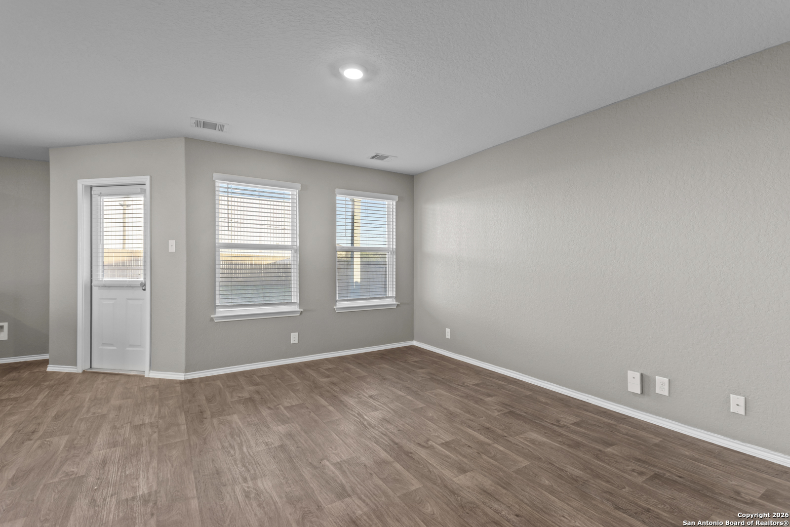 4106 Winterfell Pass Converse, TX 78109 - Photo 7 of 31 wooden floor in an empty room with a window