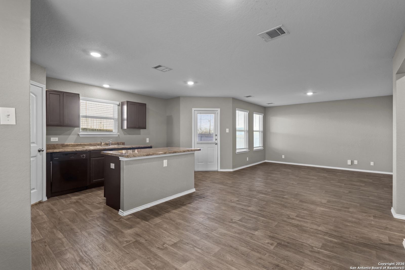 4106 Winterfell Pass Converse, TX 78109 - Photo 10 of 31 a large kitchen with granite countertop a large counter top and stainless steel appliances