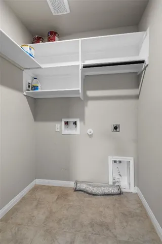 a view of storage and utility room with empty racks