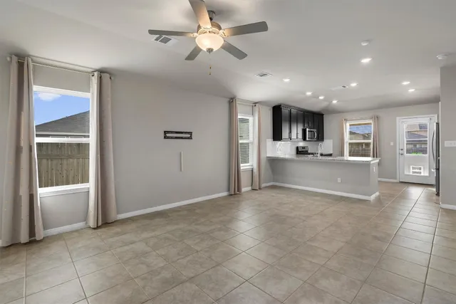 a view of a kitchen with a sink and a window