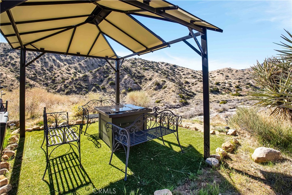 49490 Big Morongo Canyon Road Morongo Valley, CA 92256 - Photo 40 of 75 a view of an outdoor sitting area with swimming pool
