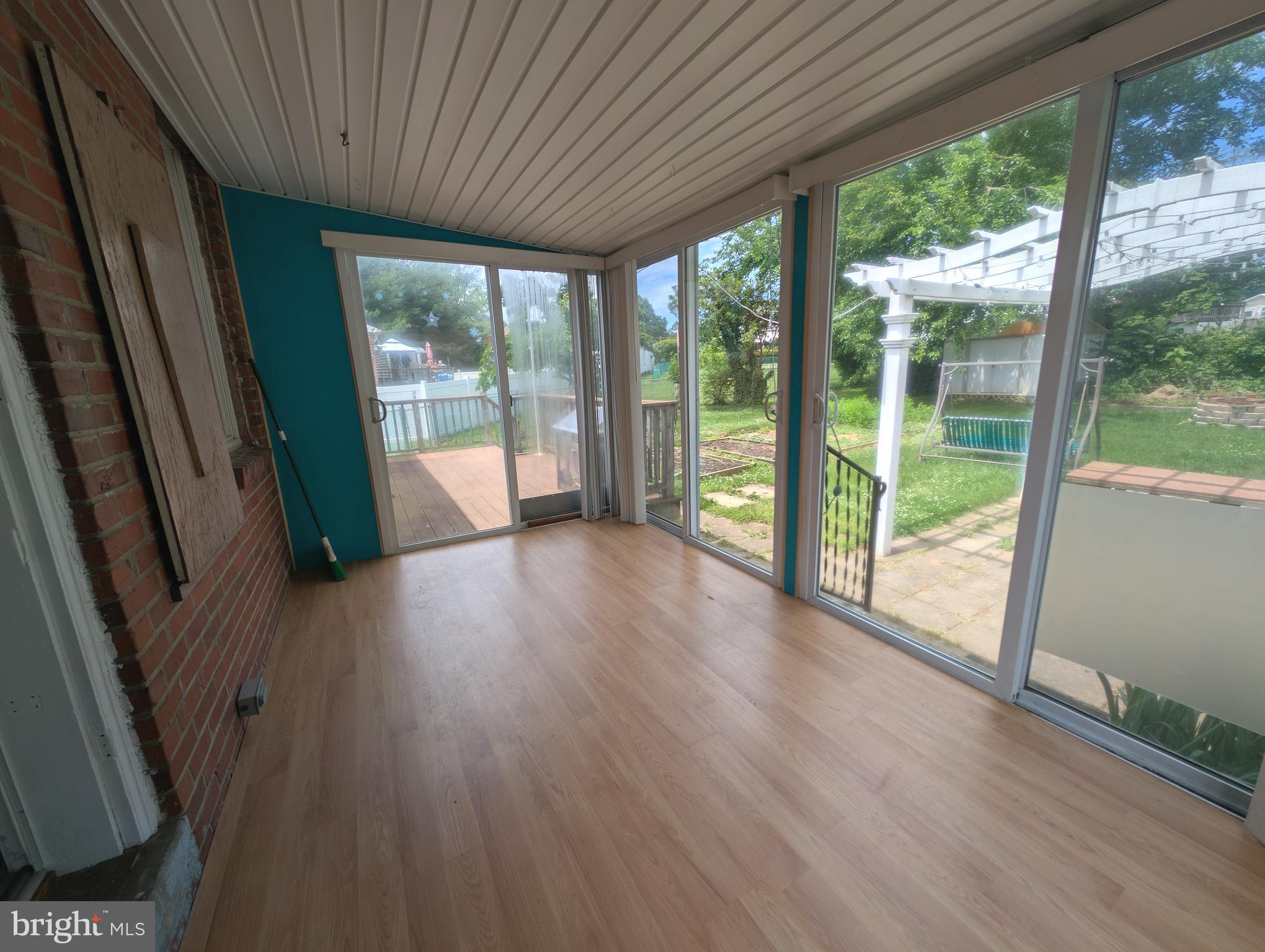 1129 Providence Road Springfield, PA 19064 - Photo 6 of 15 a view of empty room with wooden floor and fan