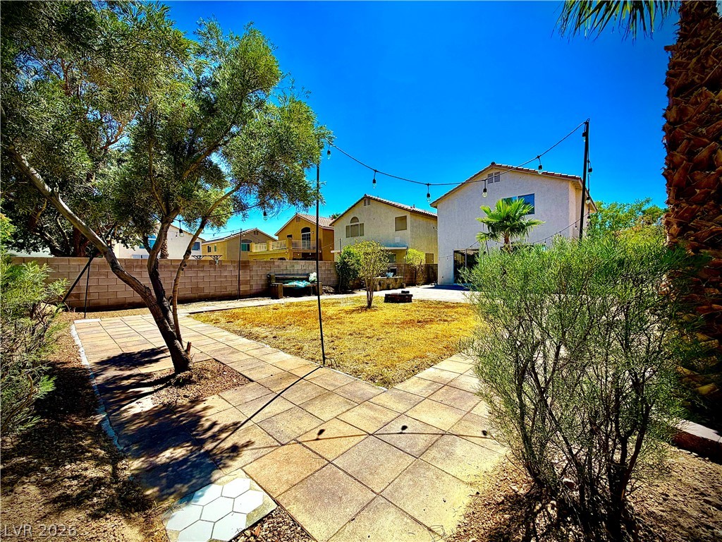3936 Gold Point Street Las Vegas, NV 89129 - Photo 22 of 23 A private yard with mature trees offers a serene outdoor escape.