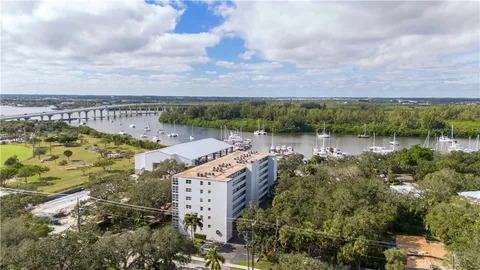 an aerial view of a house with a lake view