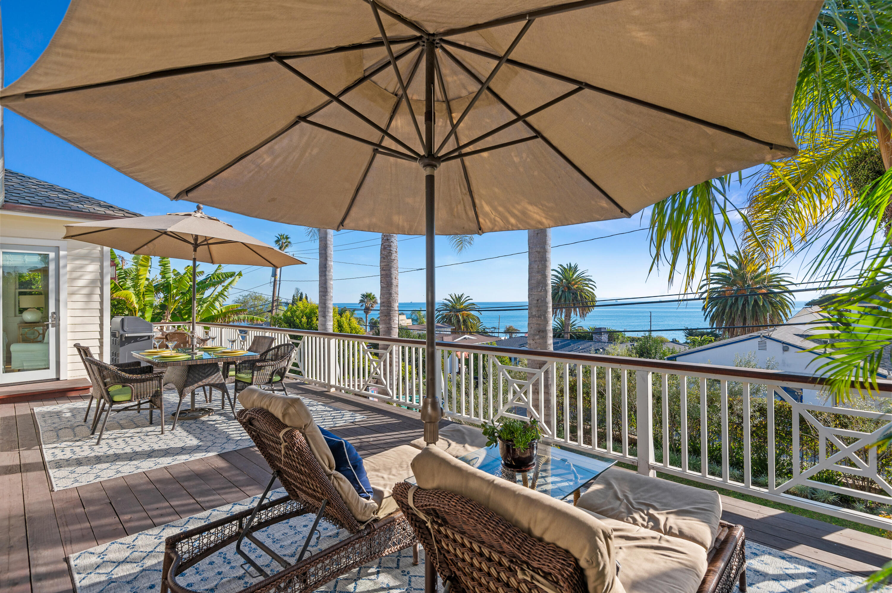 Undisclosed Address Summerland, CA 93067 - Photo 12 of 27 a view of a patio with couches under an umbrella