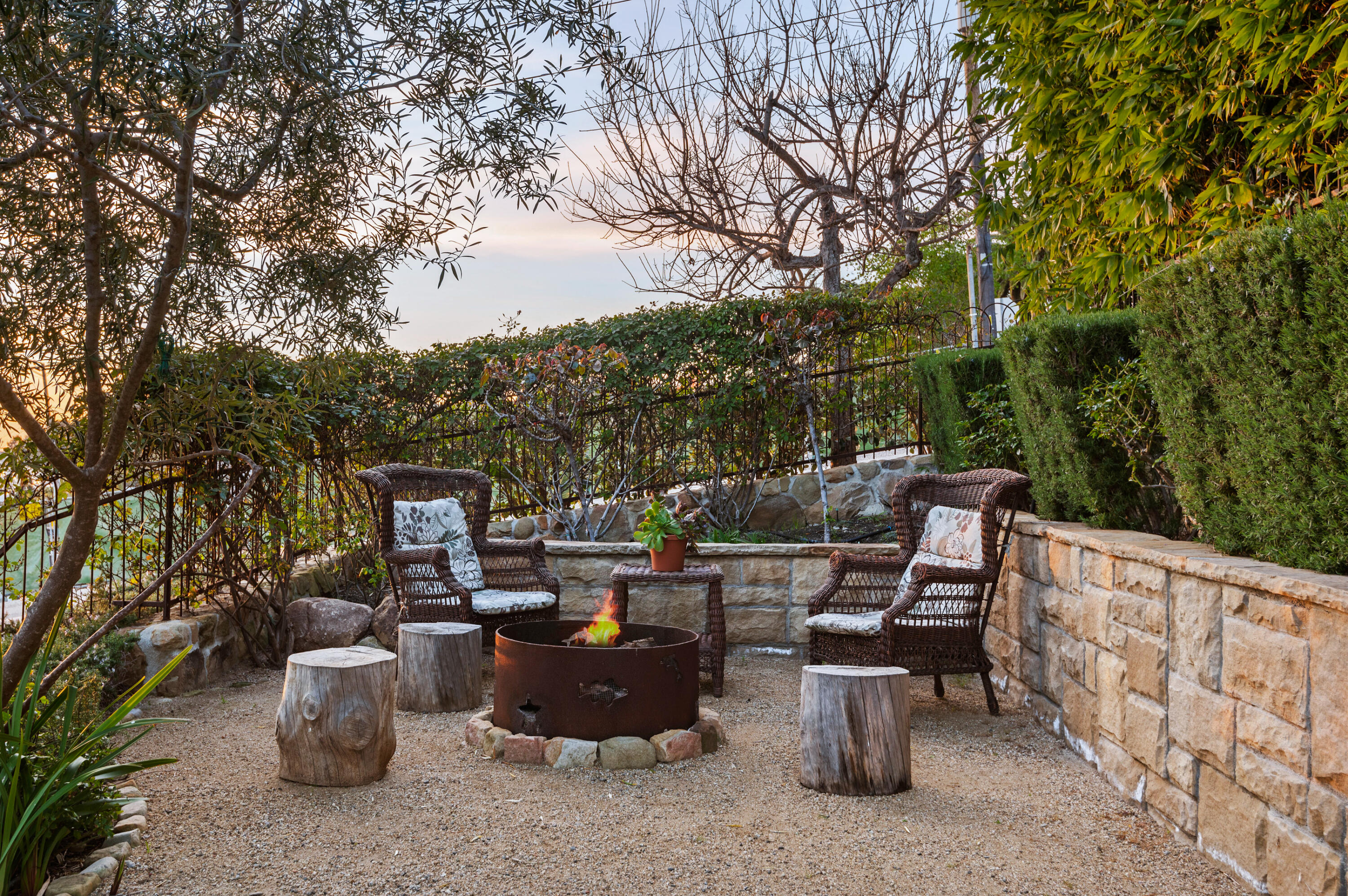 Undisclosed Address Summerland, CA 93067 - Photo 27 of 27 a view of a patio with table and chairs potted plants and large tree
