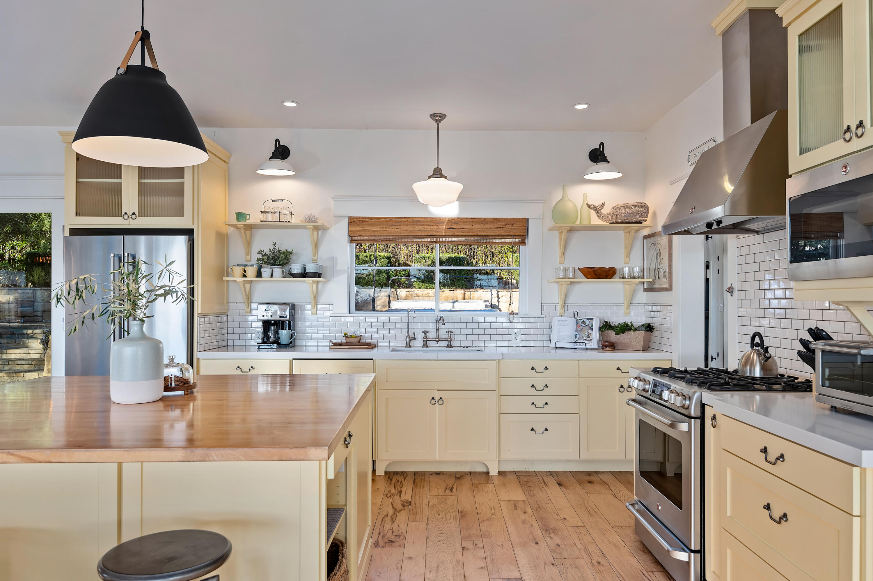 Undisclosed Address Summerland, CA 93067 - Photo 9 of 27 a large kitchen with granite countertop a sink a counter space appliances and cabinets