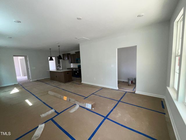 a view of an house with swimming pool and sitting area