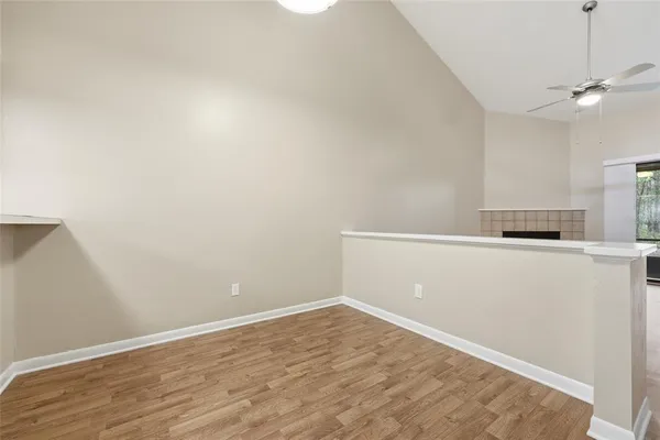 a view of empty space with wooden floor