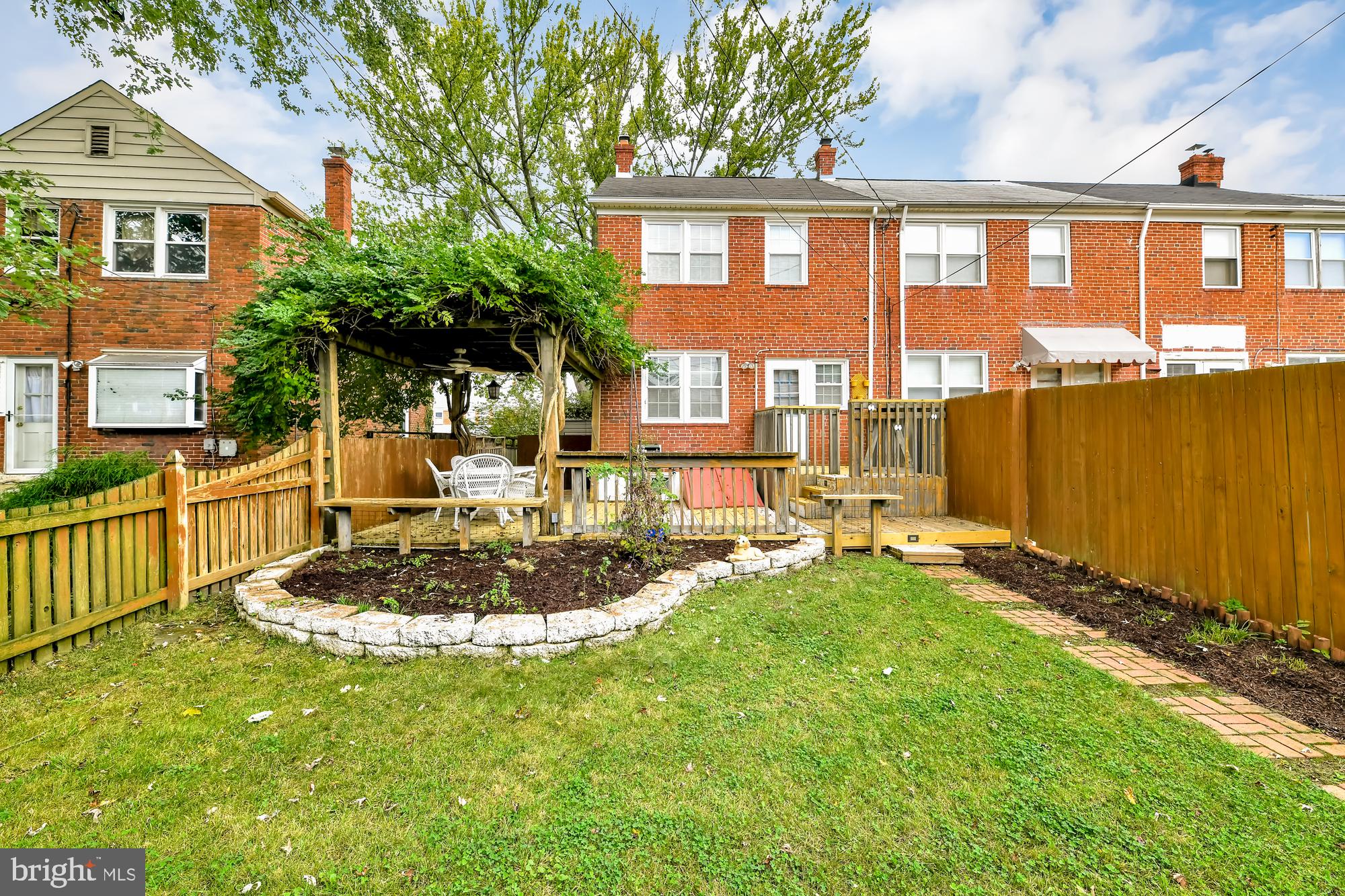 8339 Ridgely Oak Road Baltimore, MD 21234 - Photo 4 of 34 Back Yard w/ Wood Privacy Fence and Landscaping