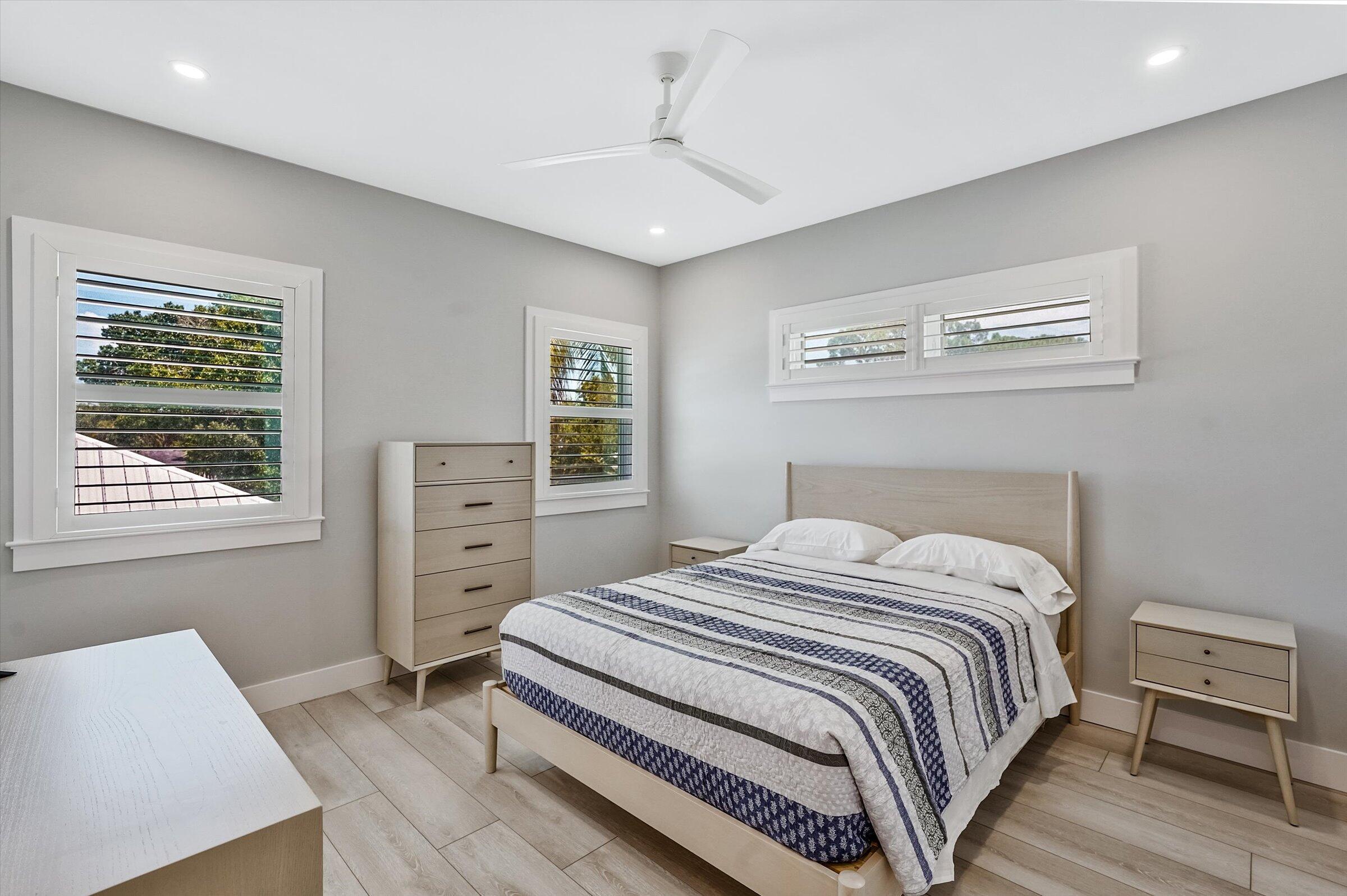 425 Hugh Street Jupiter, FL 33458 - Photo 28 of 41 a bedroom with a bed and a window