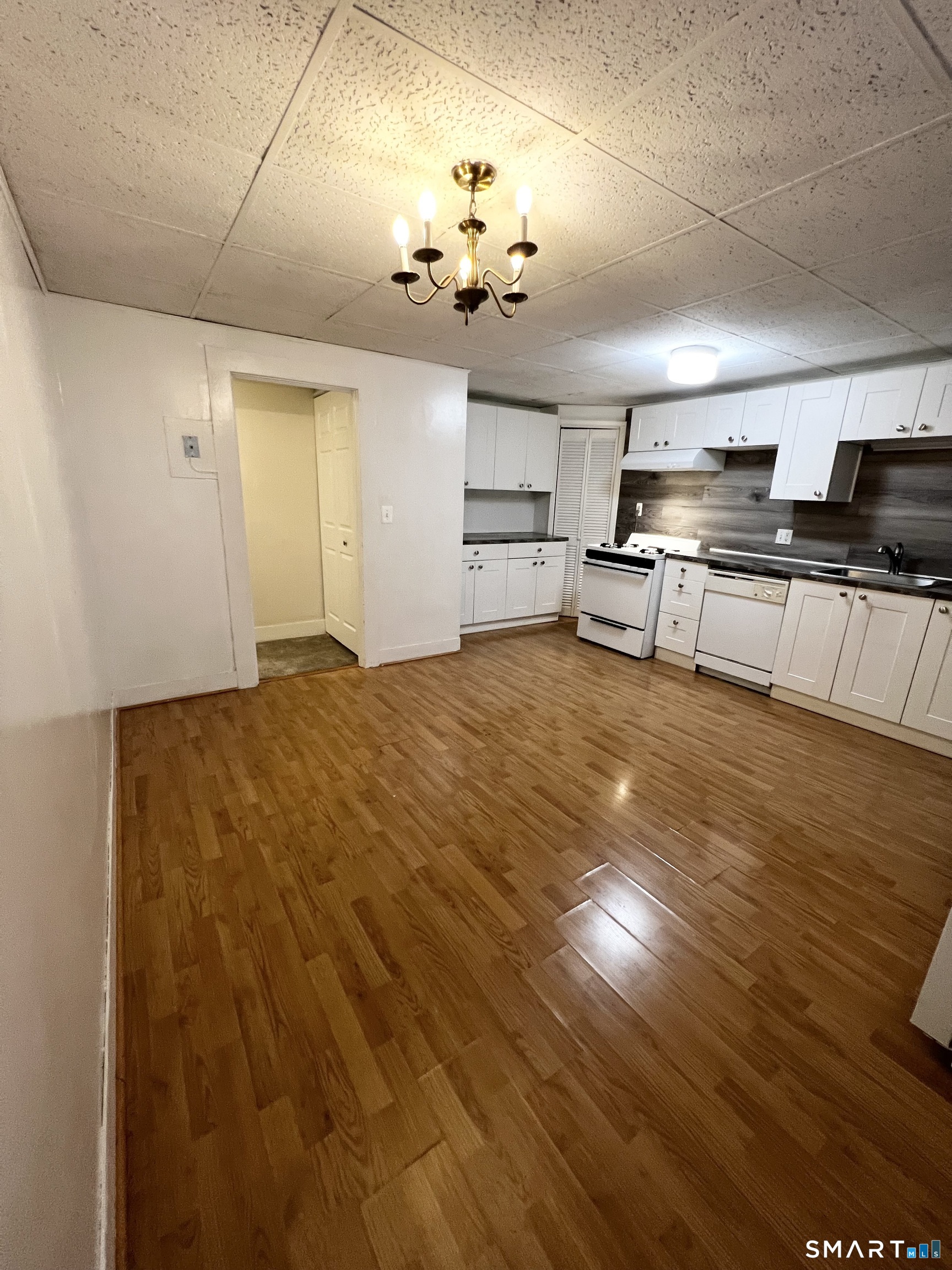 143 William Street, Unit A Middletown, CT 06457 - Photo 5 of 20 a view of a kitchen with stove and cabinets