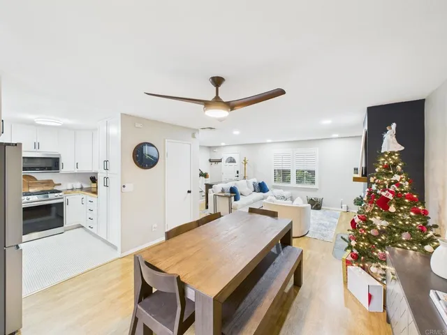 a very nice looking living room with a large window and a fireplace