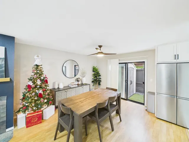 a table with chairs and wooden floor