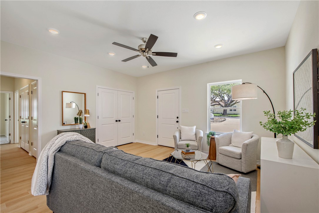 2006 Stevens Drive Bryan, TX 77803 - Photo 5 of 18 a living room with furniture and a potted plant
