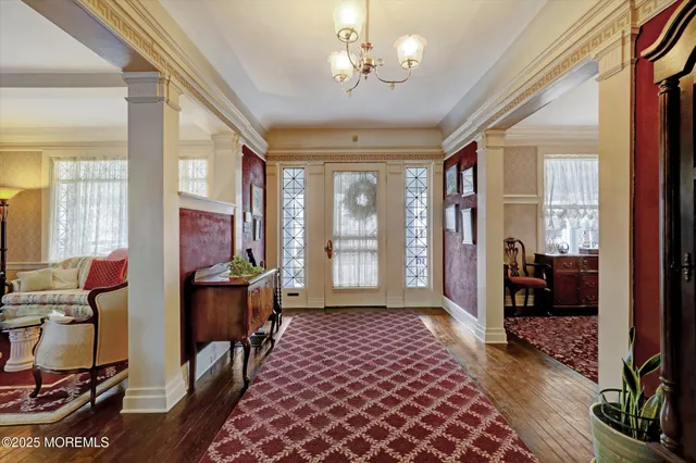 a view of a room with furniture wooden floor and windows
