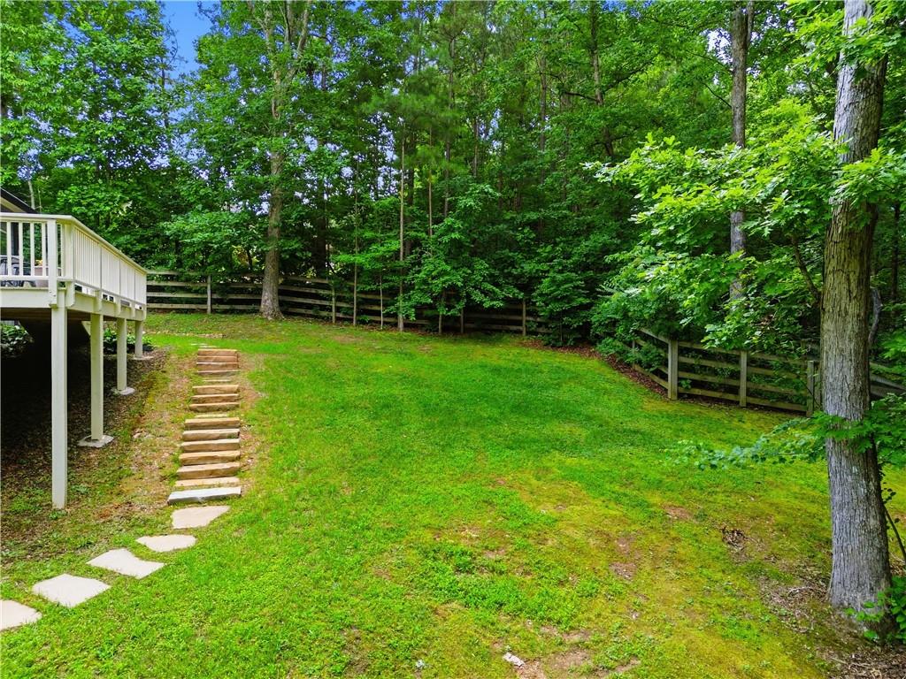 302 Spence Circle Ball Ground, GA 30107 - Photo 43 of 55 a view of a backyard with a deck