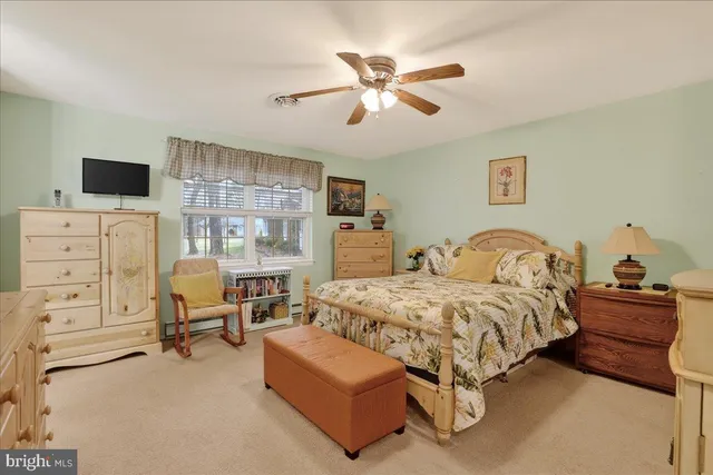 a bedroom with furniture and white furniture