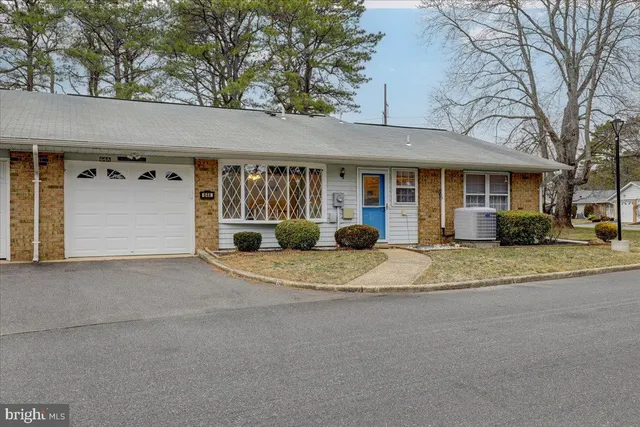 a view of a house with a yard and garage