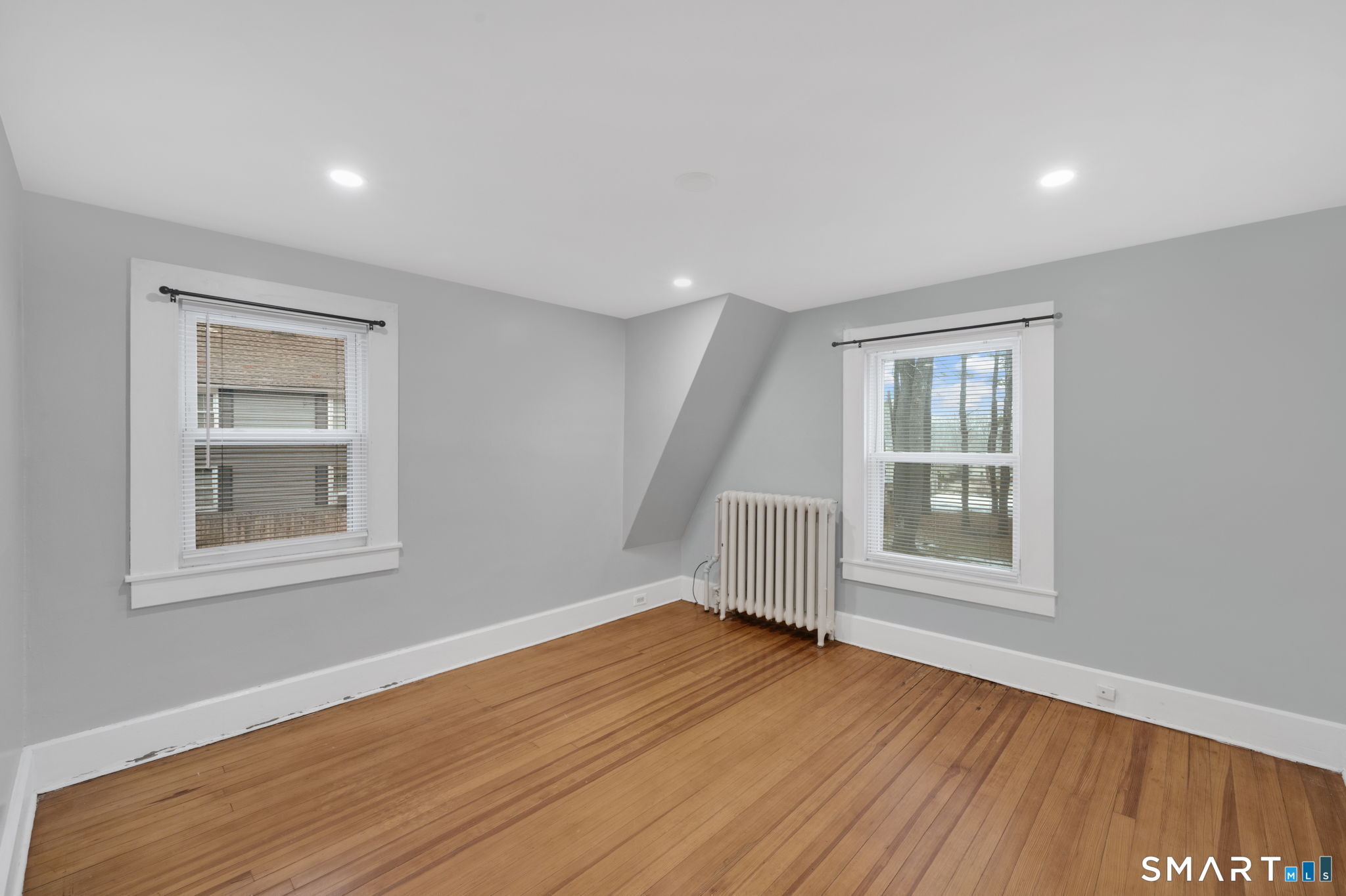 37 Bushy Hill Road Simsbury, CT 06070 - Photo 14 of 23 a view of an empty room with wooden floor and a window