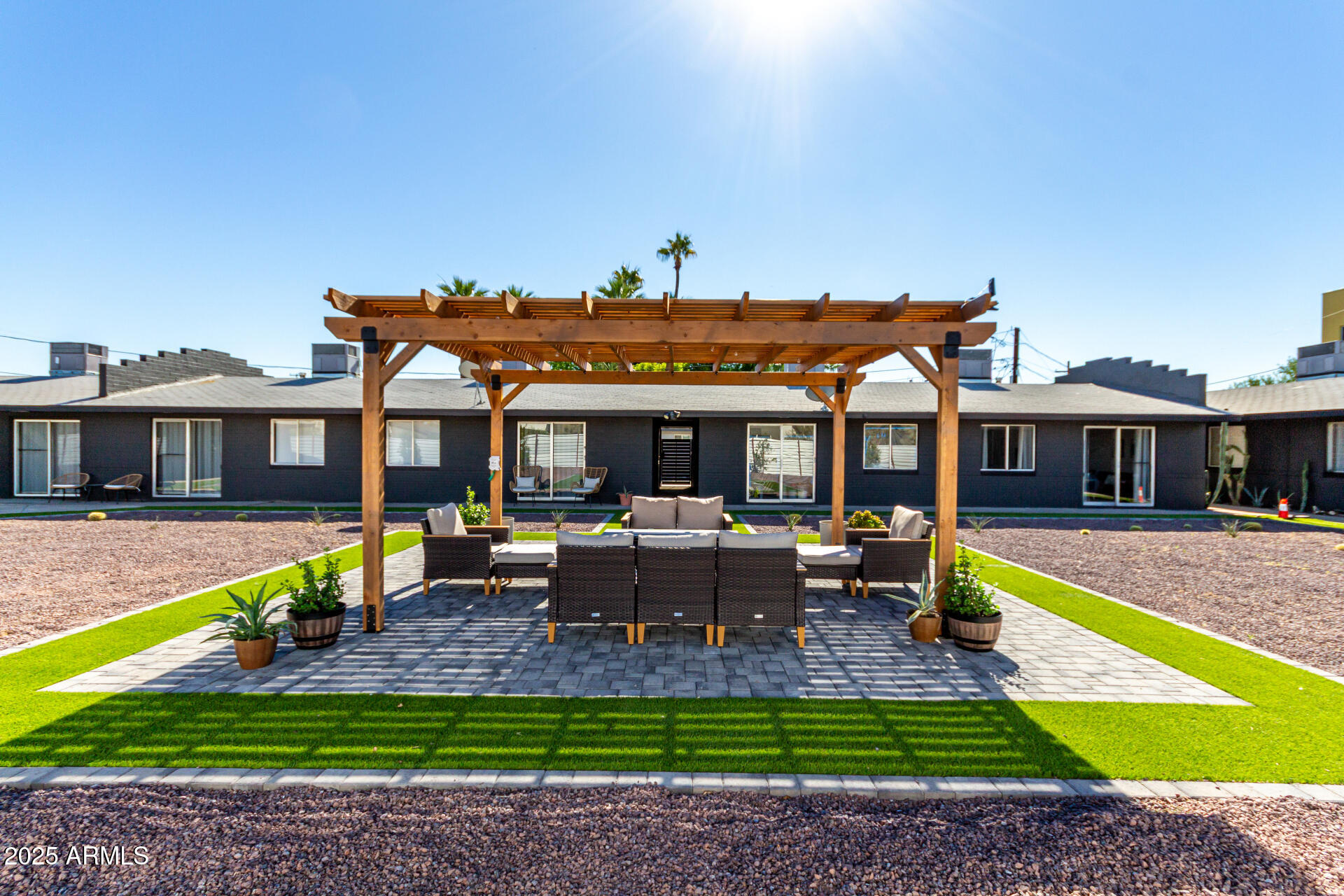 a view of a house with swimming pool and sitting area