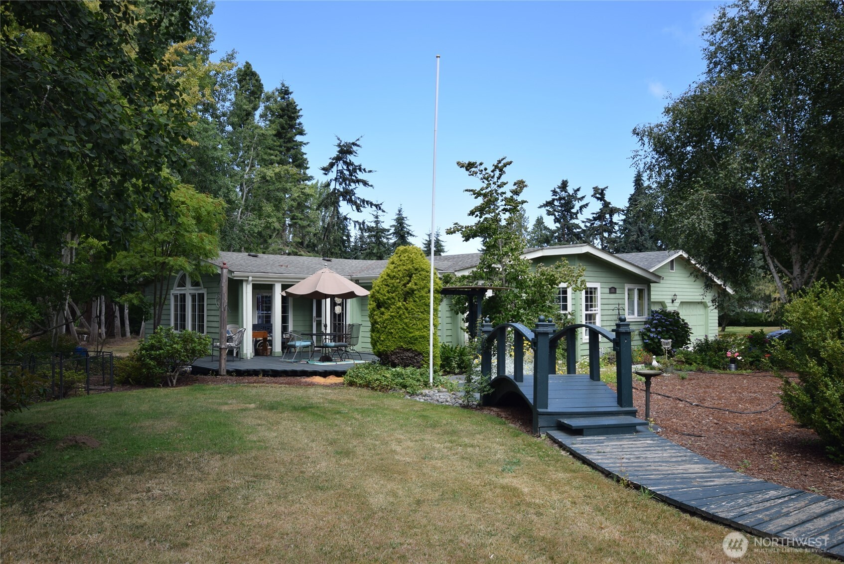 171 Foxtail Lane Sequim, WA 98382 - Photo 3 of 34 a view of house with a garden