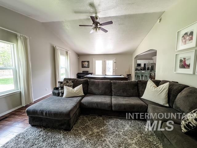 808 O'Leary Way Twin Falls, ID 83301 - Photo 8 of 37 Spacious living area featuring a vaulted ceiling and a ceiling fan