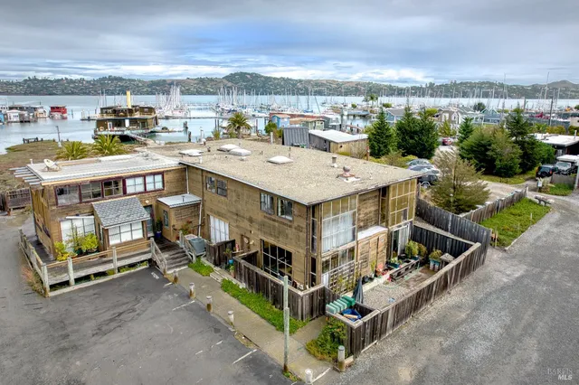 an aerial view of a house with a yard