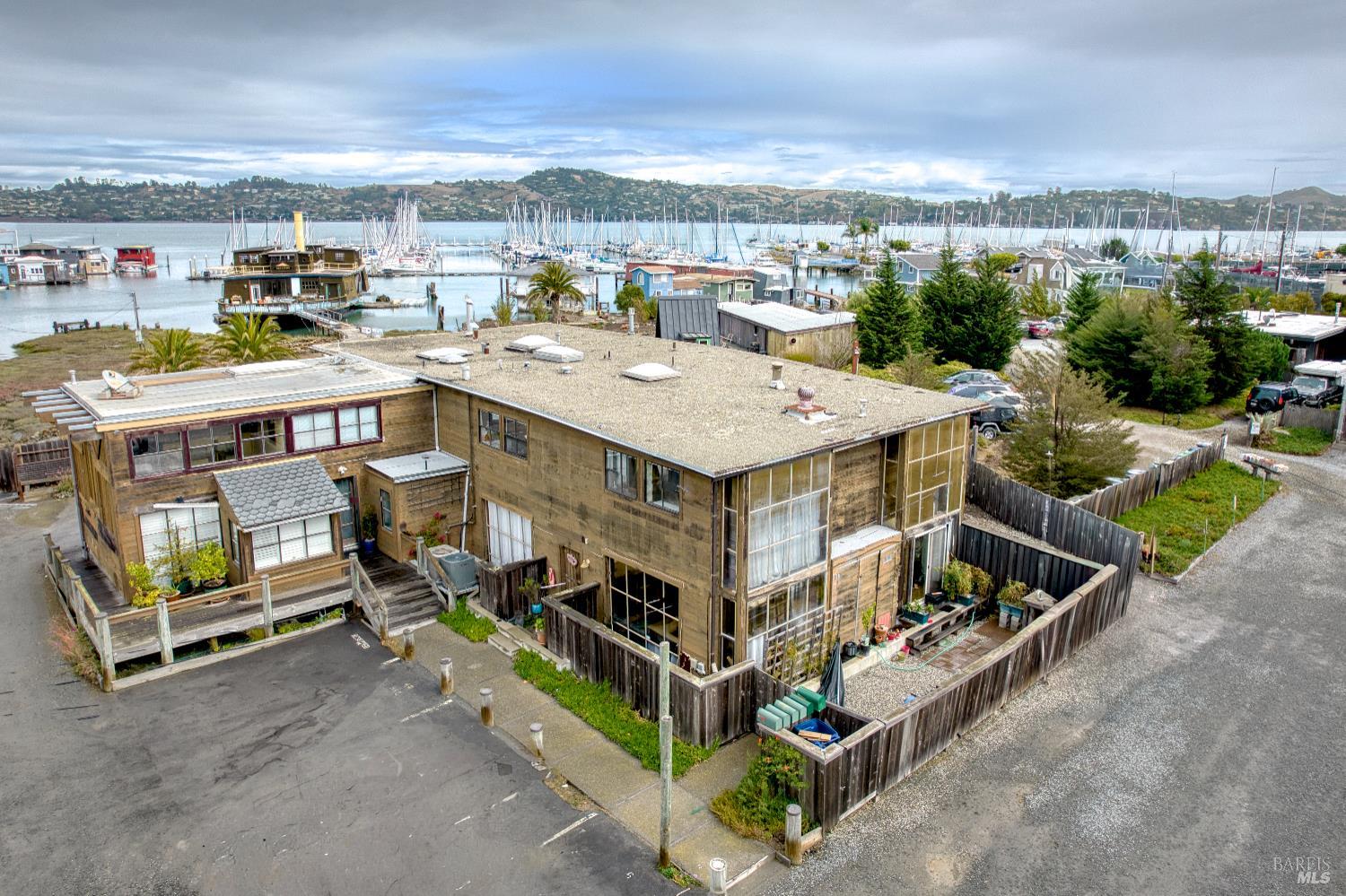 an aerial view of a house with a yard