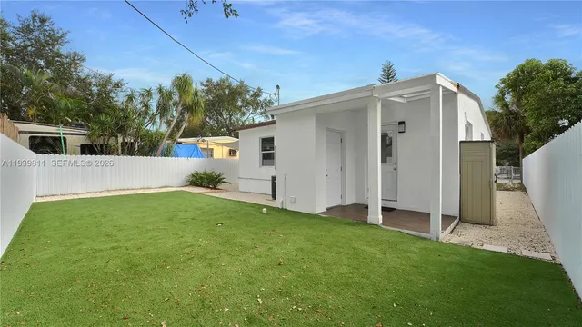 a view of backyard with cabin