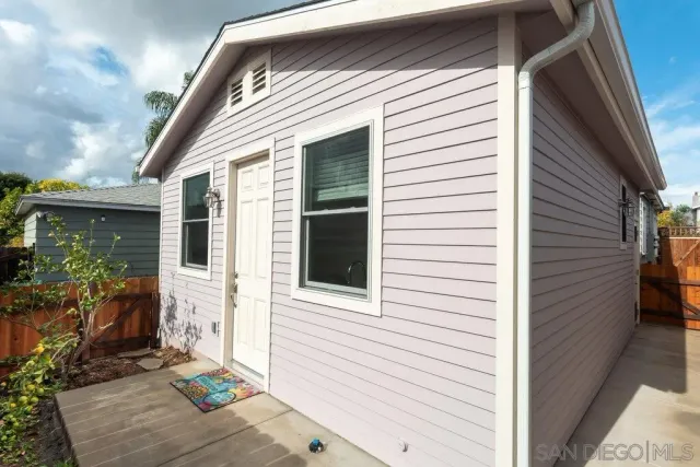 a view of a house with porch and furniture