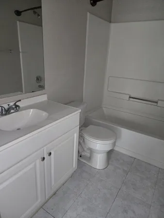 a bathroom with a toilet and a sink
