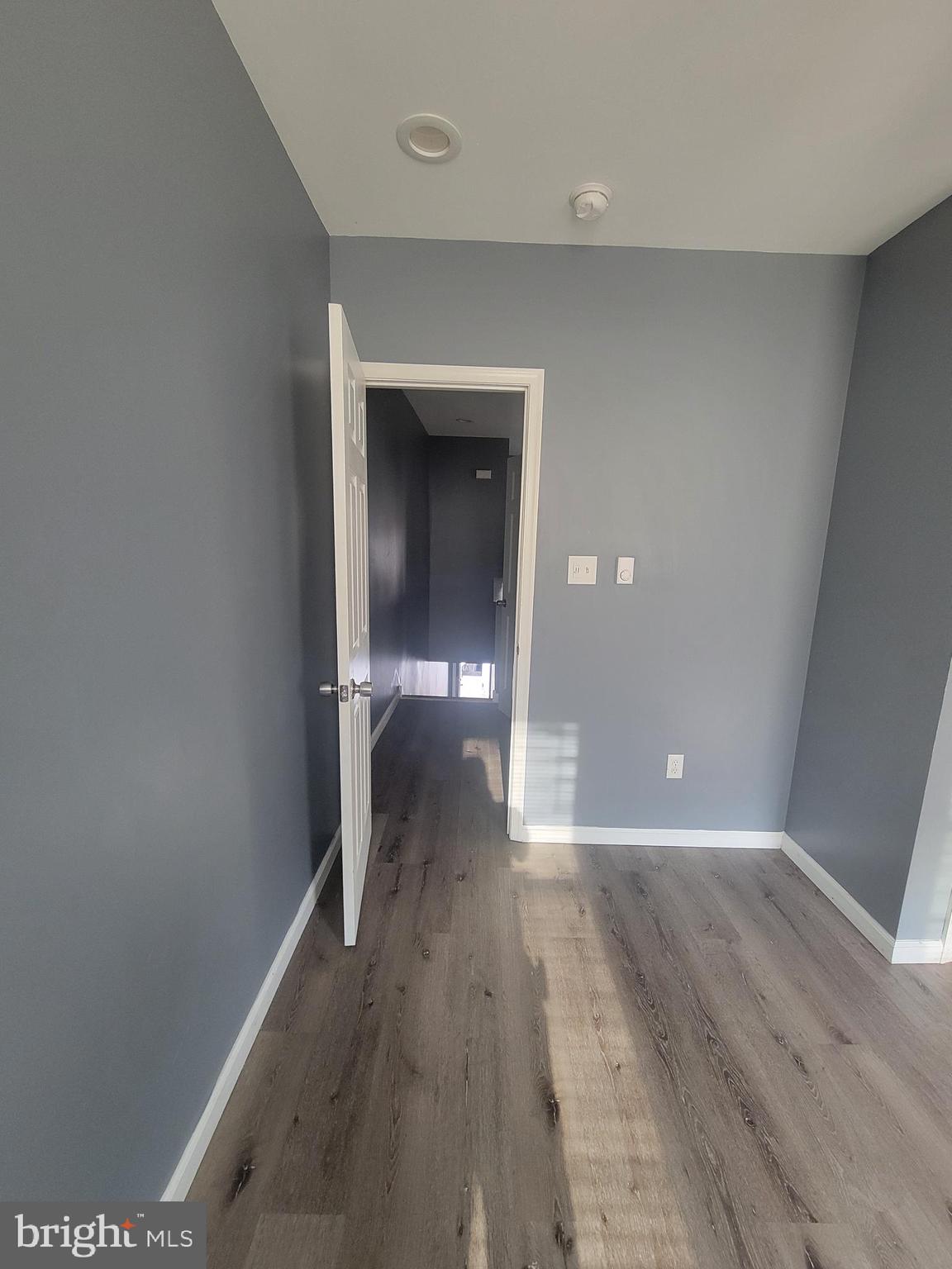4248 North 7th Street, Unit 2 Philadelphia, PA 19140 - Photo 3 of 6 a view of a hallway with wooden floor