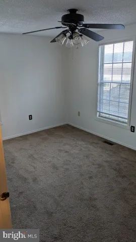 an empty room with a empty space and a window