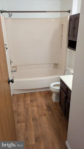 a bathroom with a shower curtain and sink