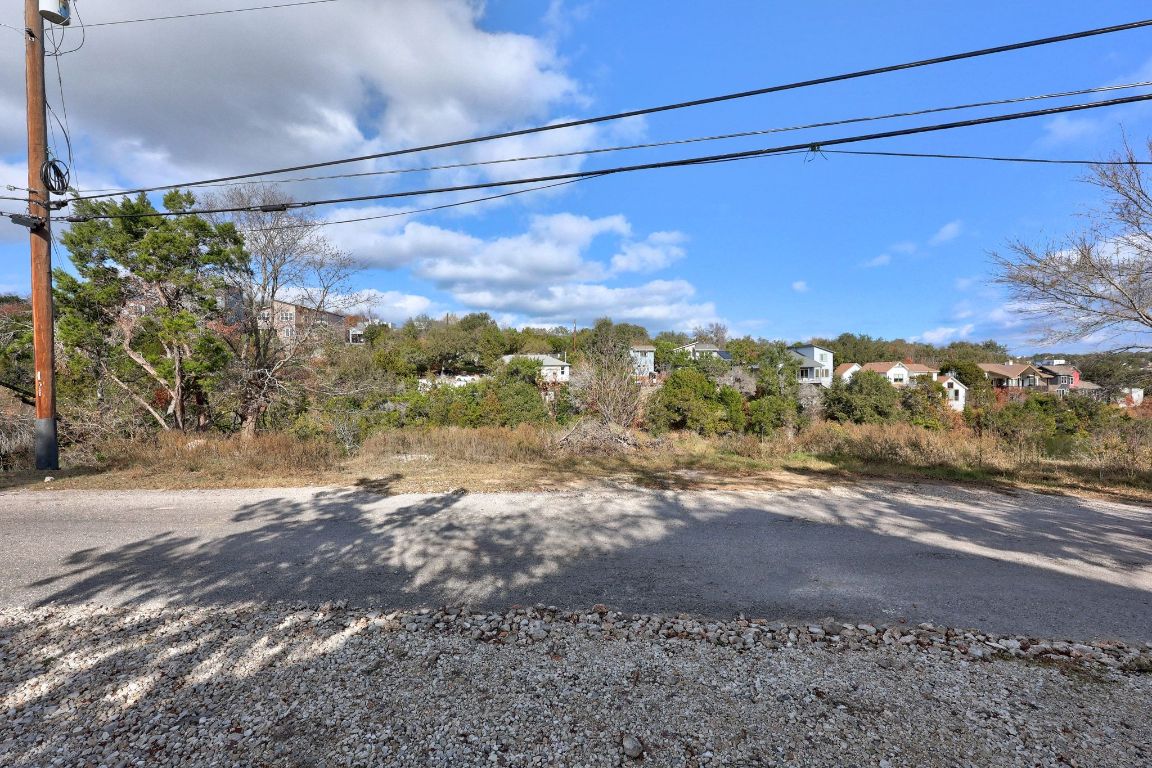 14506 Hunters Pass Austin, TX 78734 - Photo 17 of 19 a view of a yard with a road