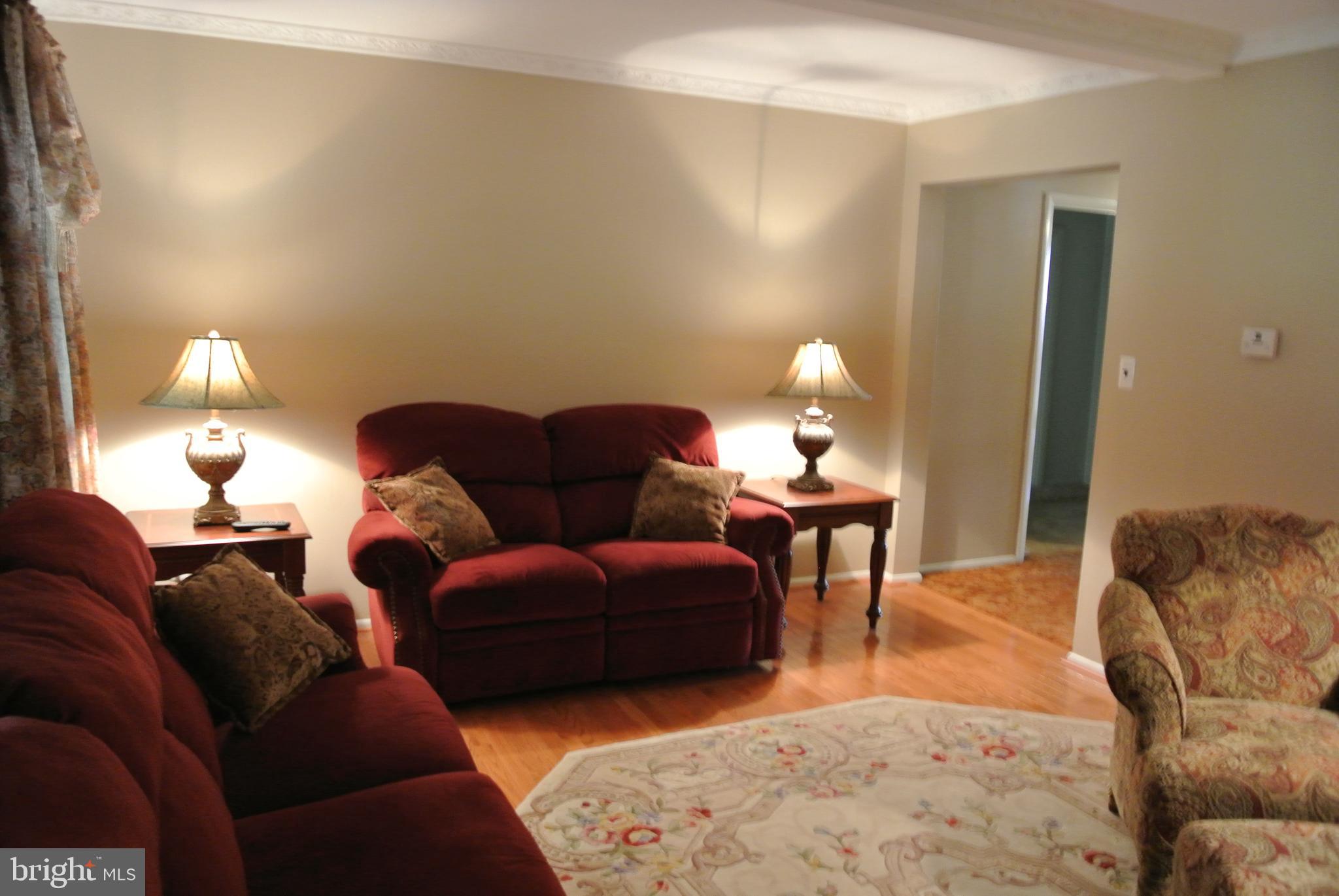 6903 Circle Road Baltimore, MD 21220 - Photo 10 of 26 Living room has distinctive moldings